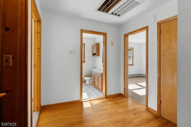 150 Buckley Ave, Oxford Twp, NJ 07863 - corridor featuring baseboard heating and light wood-style flooring
