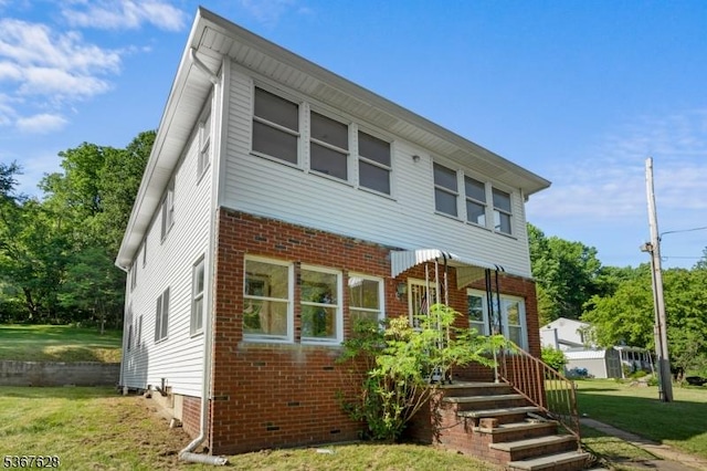 150 Buckley Ave, Oxford Twp, NJ 07863 - view of front facade featuring a front lawn, brick siding, and crawl space
