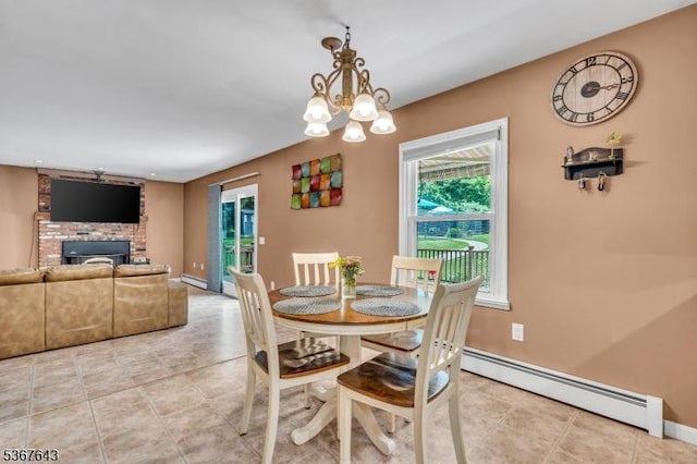 2 Angus Ln, Blairstown Twp, NJ 07825 - dining room with baseboard heating, plenty of natural light, a fireplace, and a chandelier