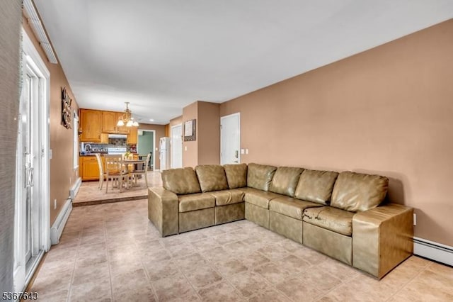 2 Angus Ln, Blairstown Twp, NJ 07825 - living area featuring a baseboard heating unit, a chandelier, and light tile patterned floors