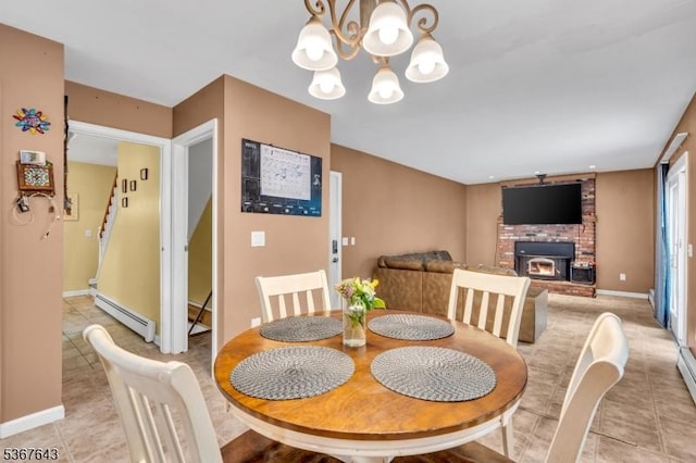 2 Angus Ln, Blairstown Twp, NJ 07825 - dining area with a baseboard radiator, light tile patterned flooring, a fireplace, a chandelier, and stairway