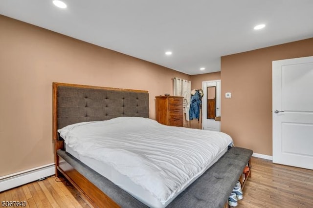 2 Angus Ln, Blairstown Twp, NJ 07825 - bedroom featuring a baseboard radiator, wood-type flooring, and recessed lighting