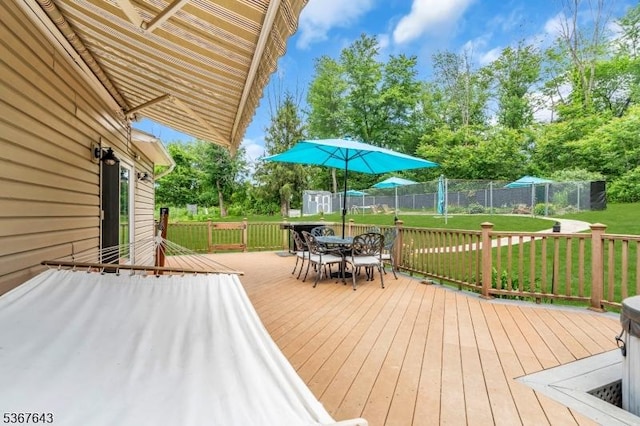 2 Angus Ln, Blairstown Twp, NJ 07825 - wooden deck with outdoor dining space, a storage shed, a fenced backyard, and view of wooded area