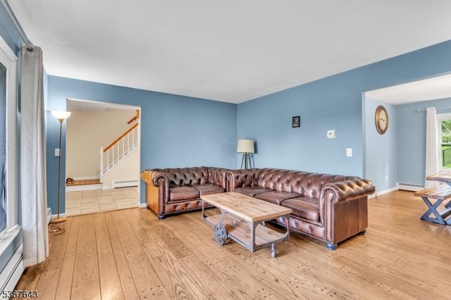 2 Angus Ln, Blairstown Twp, NJ 07825 - living room featuring a baseboard radiator, baseboard heating, stairway, and light wood-style flooring