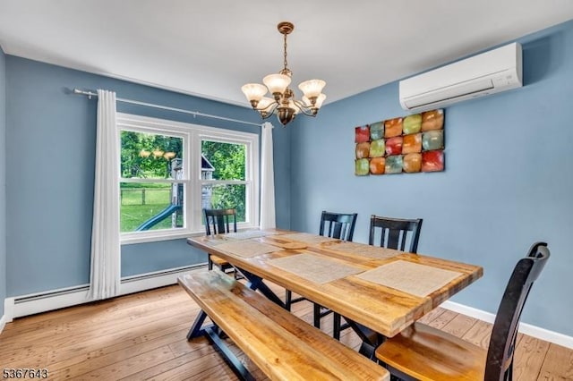 2 Angus Ln, Blairstown Twp, NJ 07825 - dining space with a wall unit AC, a baseboard heating unit, a chandelier, and light wood-type flooring