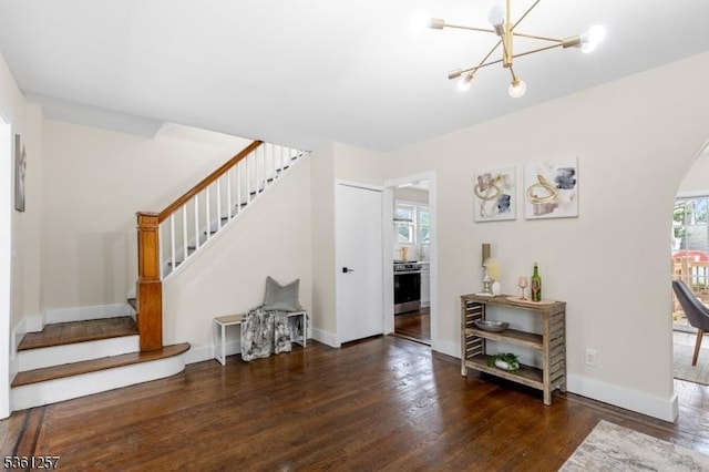 910 Caldwell Ave, Union Twp, NJ 07083 - living room with stairway, wood finished floors, a chandelier, and arched walkways