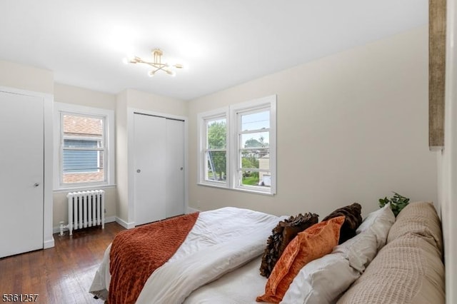 910 Caldwell Ave, Union Twp, NJ 07083 - bedroom featuring radiator heating unit, dark wood-style flooring, a closet, and a chandelier