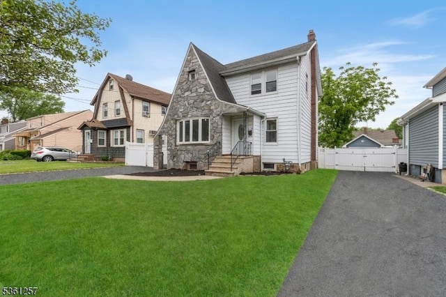910 Caldwell Ave, Union Twp, NJ 07083 - view of front of property featuring a gate, a chimney, and stone siding