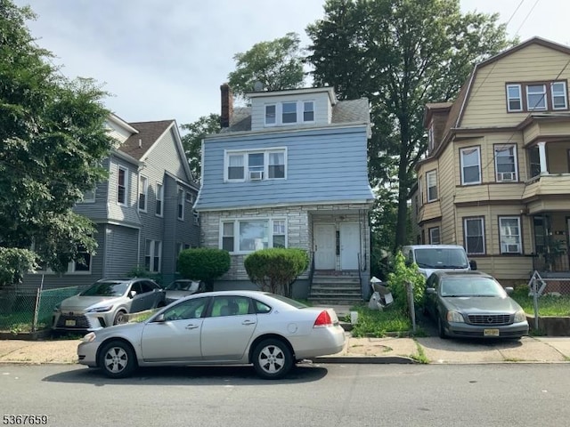 116 Mapes Ave Unit 3, Newark City, NJ 07112 - view of front of house with stone siding and a chimney