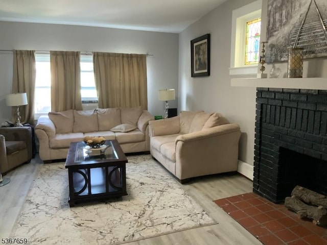 116 Mapes Ave Unit 3, Newark City, NJ 07112 - living room featuring a brick fireplace, plenty of natural light, and wood finished floors