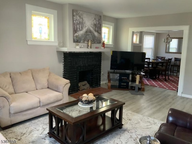 116 Mapes Ave Unit 3, Newark City, NJ 07112 - living area with wood finished floors and a brick fireplace