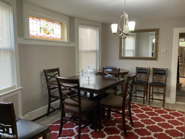116 Mapes Ave Unit 3, Newark City, NJ 07112 - dining area with baseboards and a chandelier