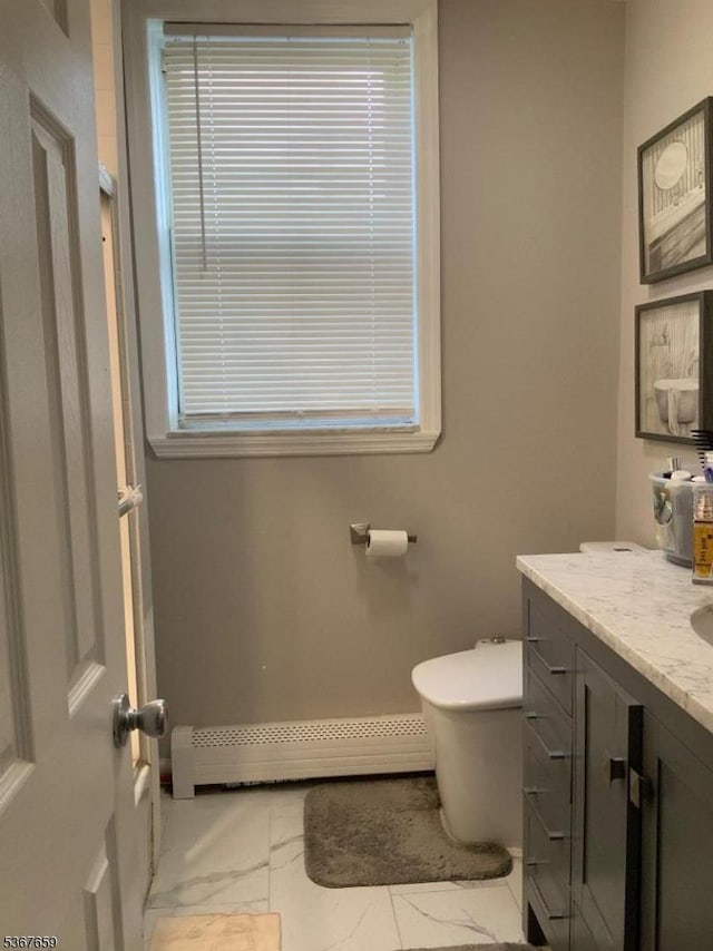 116 Mapes Ave Unit 3, Newark City, NJ 07112 - bathroom with a baseboard radiator, vanity, and marble finish floors