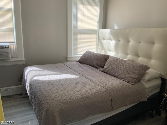116 Mapes Ave Unit 3, Newark City, NJ 07112 - bedroom with wood finished floors and multiple windows