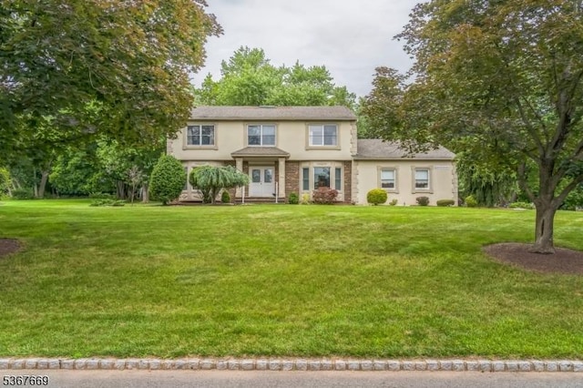 14 Greensview Dr, Scotch Plains Twp, NJ 07076 - view of front of house featuring stucco siding and a front lawn