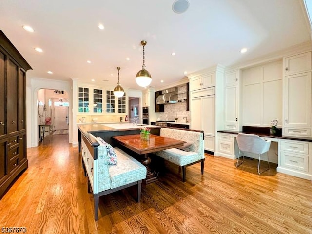 15 Poplar Ln, Chatham Twp, NJ 07928 - dining room with light wood-type flooring, recessed lighting, ornamental molding, and built in study area