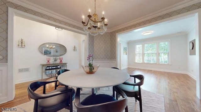 15 Poplar Ln, Chatham Twp, NJ 07928 - dining area featuring a chandelier, light wood-type flooring, ornamental molding, and wallpapered walls