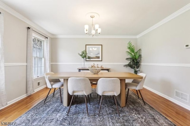 211 Woods End Dr, Bernards Twp, NJ 07920 - dining area featuring wood finished floors, a chandelier, and crown molding