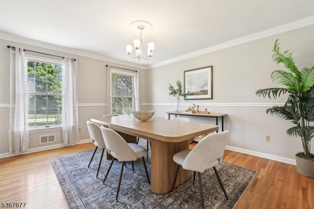 211 Woods End Dr, Bernards Twp, NJ 07920 - dining space featuring a chandelier, plenty of natural light, light wood-type flooring, and ornamental molding