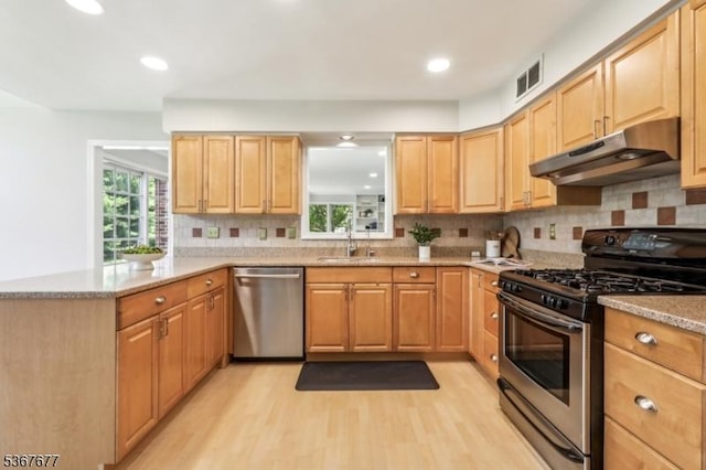 211 Woods End Dr, Bernards Twp, NJ 07920 - kitchen featuring appliances with stainless steel finishes, under cabinet range hood, light wood-style flooring, backsplash, and healthy amount of natural light