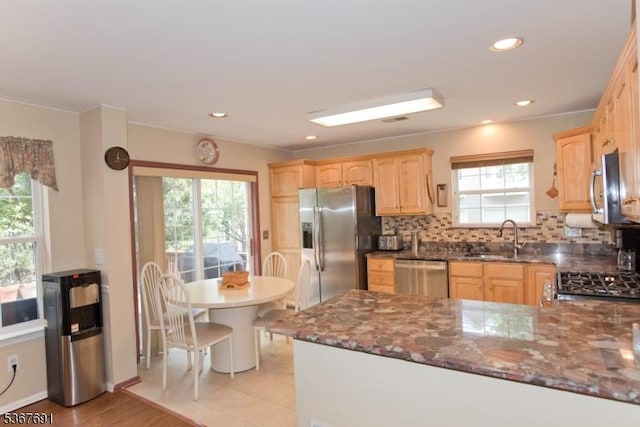 425 Diablo Ct, Mahwah Twp, NJ 07430 - kitchen featuring stainless steel appliances, light brown cabinetry, backsplash, dark stone counters, and a peninsula