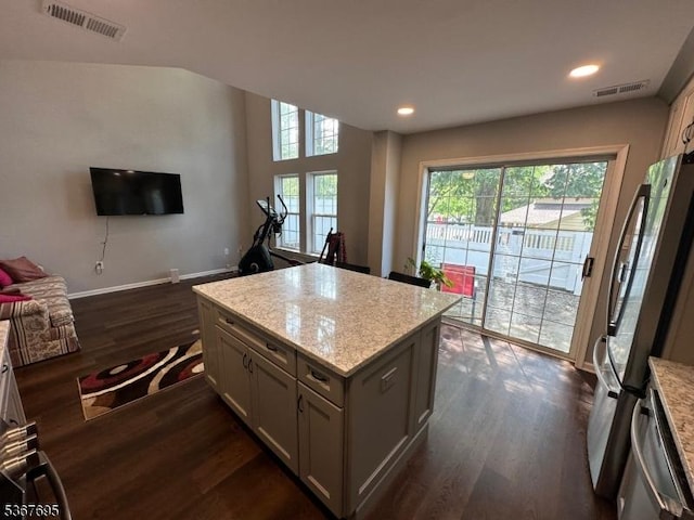 1002 Timberbrooke Dr, Bedminster Twp, NJ 07921 - kitchen featuring dark wood-type flooring, a center island, appliances with stainless steel finishes, recessed lighting, and light stone countertops