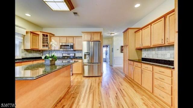 4 Lindsay Ln, Sparta Twp, NJ 07871 - kitchen with stainless steel appliances, glass insert cabinets, light wood-type flooring, decorative backsplash, and wainscoting