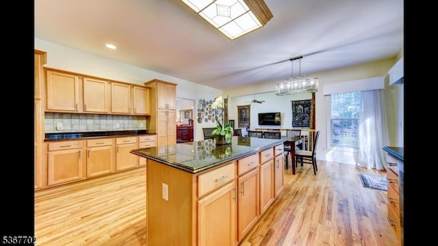 4 Lindsay Ln, Sparta Twp, NJ 07871 - kitchen with light wood-type flooring, a kitchen island, decorative backsplash, ceiling fan, and recessed lighting