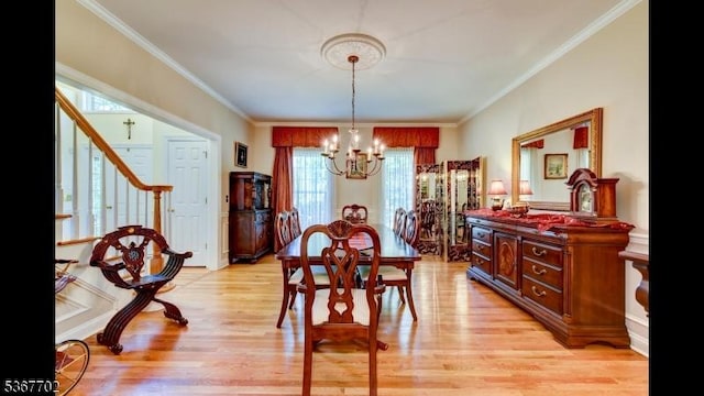 4 Lindsay Ln, Sparta Twp, NJ 07871 - dining room with a chandelier, light wood-style flooring, ornamental molding, and stairs