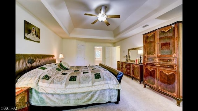 4 Lindsay Ln, Sparta Twp, NJ 07871 - bedroom featuring light colored carpet, a tray ceiling, and ceiling fan
