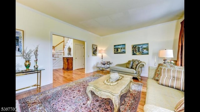 4 Lindsay Ln, Sparta Twp, NJ 07871 - living area featuring wood finished floors, ornamental molding, and stairs