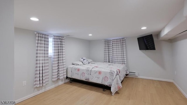 114 Oakley St, Roselle Boro, NJ 07203 - bedroom featuring light wood-style floors, recessed lighting, and a baseboard heating unit