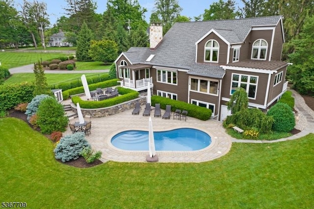 52 W Main St, Mendham Boro, NJ 07945 - rear view of property featuring a lawn, a patio area, and an outdoor pool