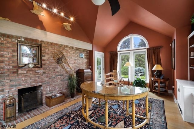 52 W Main St, Mendham Boro, NJ 07945 - living room with a fireplace, light wood-type flooring, brick wall, and vaulted ceiling