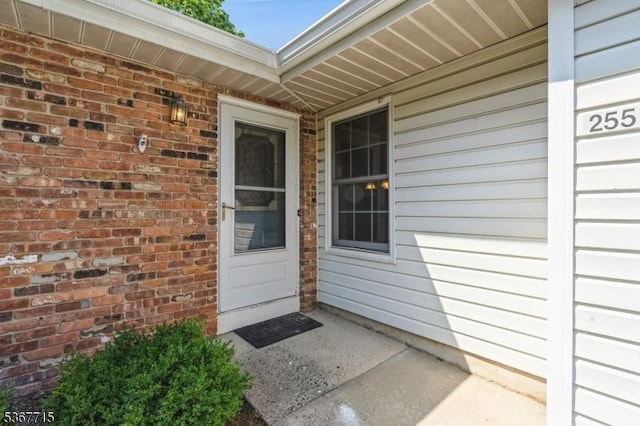 255 Glastonbury Ln, Franklin Twp, NJ 08873 - view of exterior entry featuring brick siding