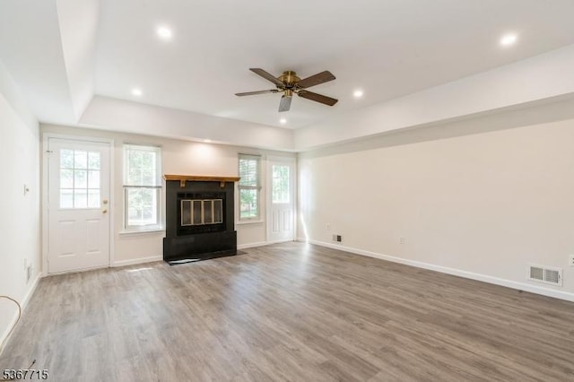 255 Glastonbury Ln, Franklin Twp, NJ 08873 - unfurnished living room featuring plenty of natural light, ceiling fan, wood finished floors, recessed lighting, and a fireplace with flush hearth