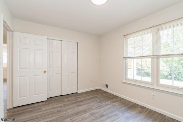 255 Glastonbury Ln, Franklin Twp, NJ 08873 - unfurnished bedroom with wood finished floors and a closet