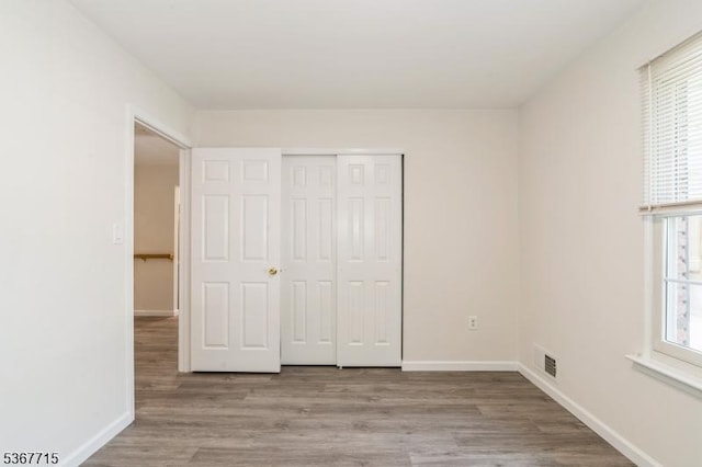 255 Glastonbury Ln, Franklin Twp, NJ 08873 - unfurnished bedroom with wood finished floors and a closet
