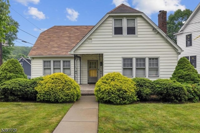74 Elm Rd, Caldwell Boro Twp, NJ 07006 - bungalow with a front yard and a chimney