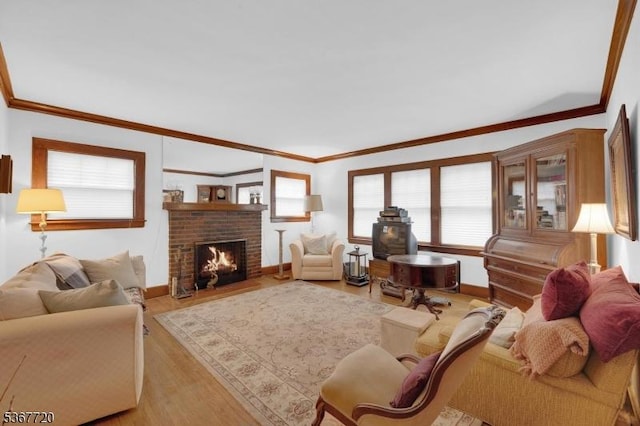 74 Elm Rd, Caldwell Boro Twp, NJ 07006 - living room with ornamental molding, light wood-style flooring, and a fireplace