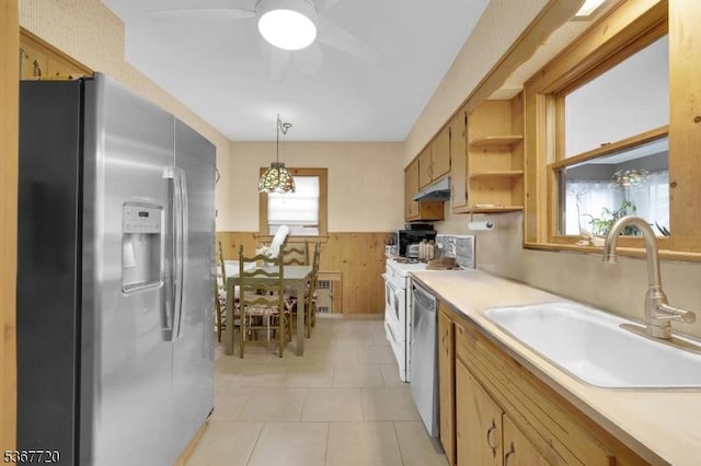 74 Elm Rd, Caldwell Boro Twp, NJ 07006 - kitchen featuring appliances with stainless steel finishes, a wainscoted wall, a ceiling fan, under cabinet range hood, and light countertops
