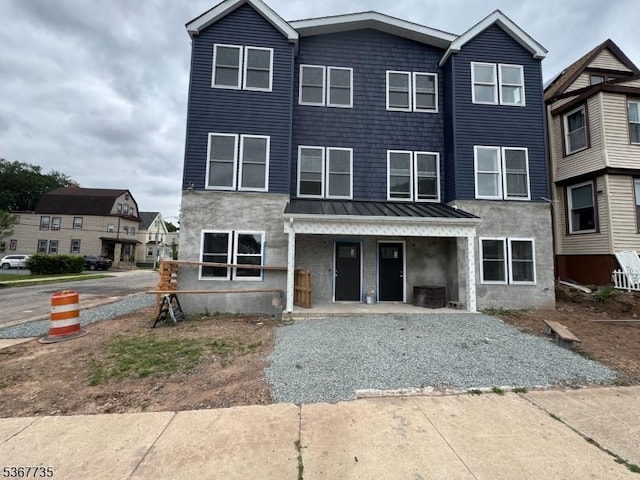 283 Rhode Island Ave Unit 2, East Orange City, NJ 07018 - townhome / multi-family property with a porch, a standing seam roof, and a metal roof