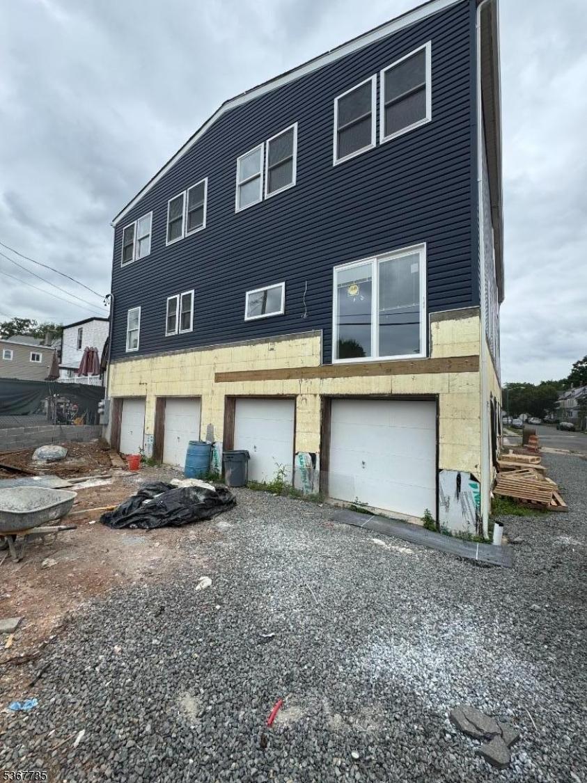 283 Rhode Island Ave Unit 2, East Orange City, NJ 07018 - rear view of property featuring a garage
