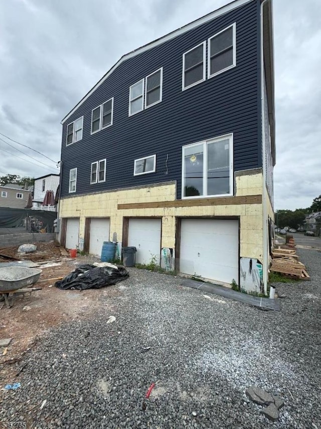 283 Rhode Island Ave Unit 2, East Orange City, NJ 07018 - rear view of property featuring a garage