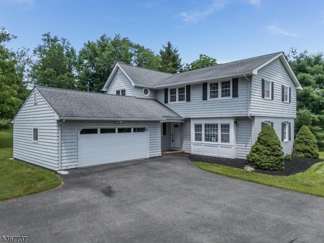 4 Orchid Pl, Clinton Twp, NJ 08833 - colonial house featuring an attached garage, asphalt driveway, and a shingled roof