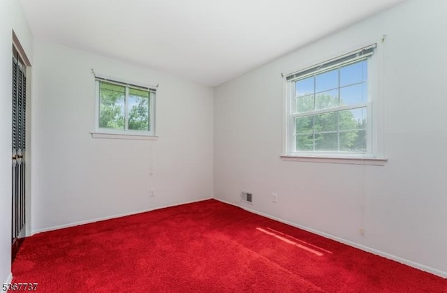 4 Orchid Pl, Clinton Twp, NJ 08833 - unfurnished bedroom featuring dark carpet and a closet