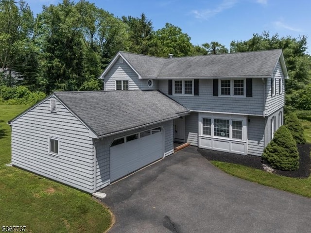 4 Orchid Pl, Clinton Twp, NJ 08833 - colonial inspired home featuring an attached garage, roof with shingles, and asphalt driveway