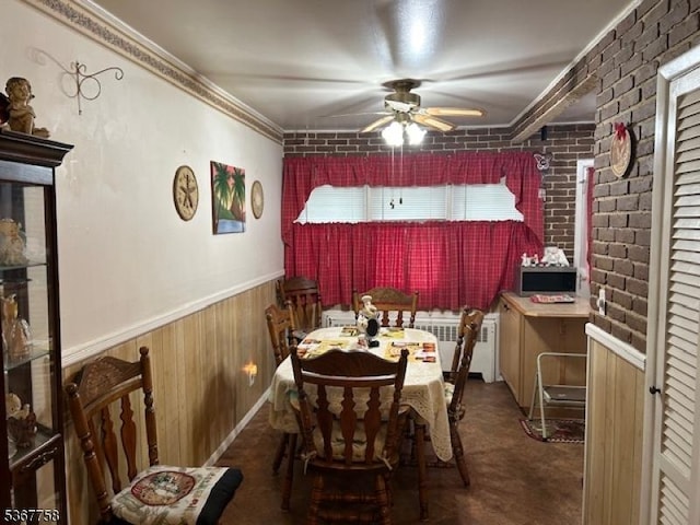 2081 Portland Ave, Scotch Plains Twp, NJ 07076 - dining space with a ceiling fan, brick wall, radiator heating unit, ornamental molding, and wainscoting