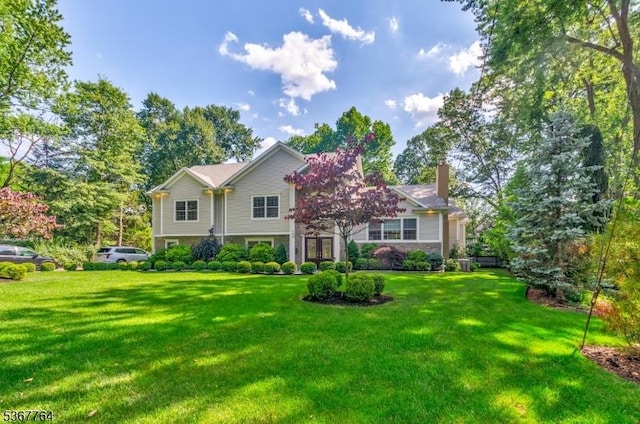106 Woodbine Cir, New Providence Boro, NJ 07974 - view of front of home featuring a front yard and a chimney
