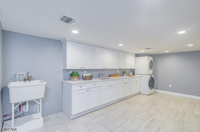 106 Woodbine Cir, New Providence Boro, NJ 07974 - washroom featuring stacked washer / dryer and recessed lighting